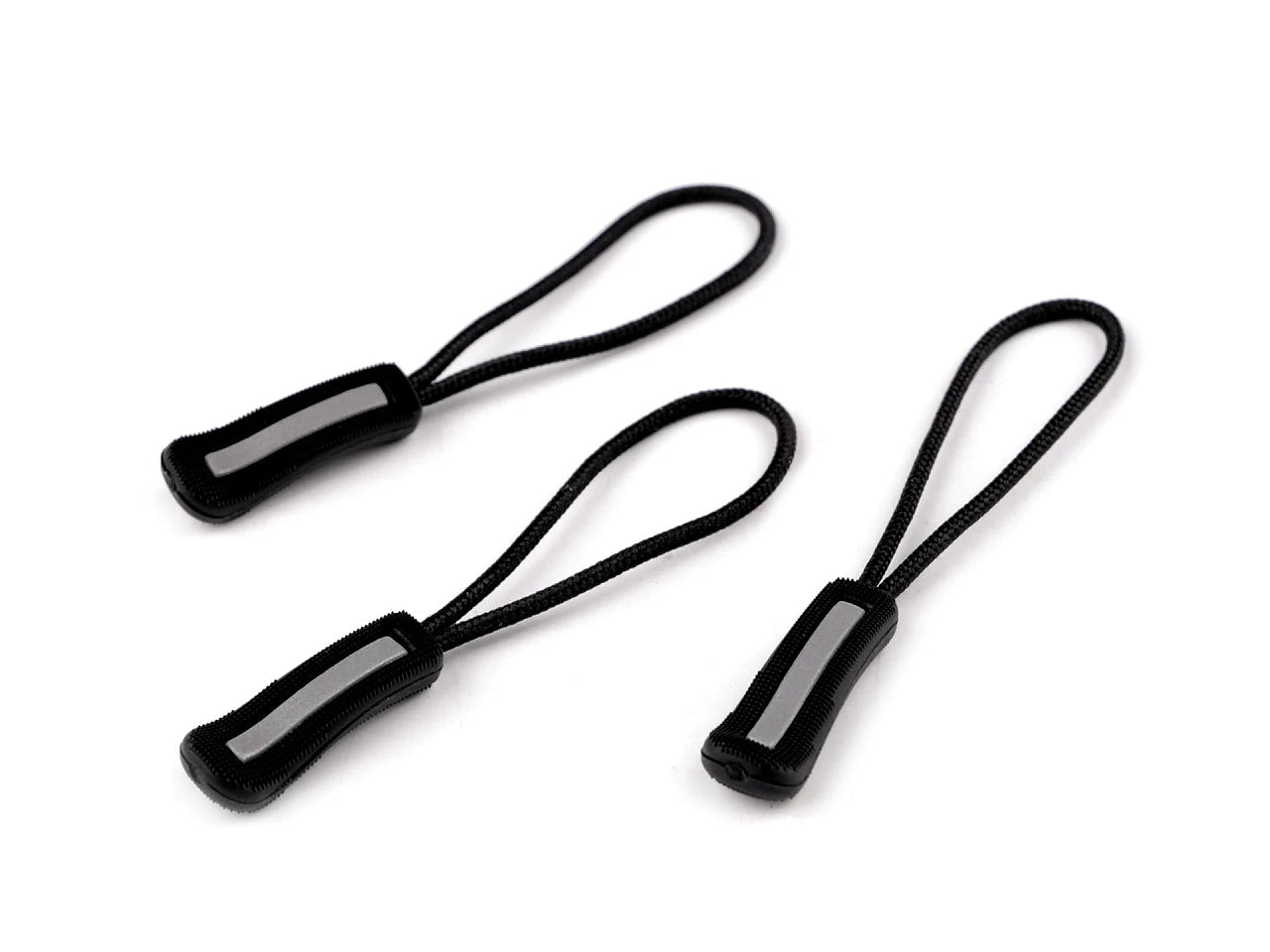 Image of a zipper pull with a reflective element – available at Charlotte Fabrics