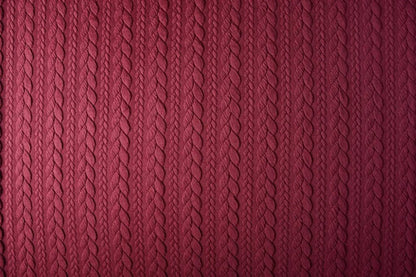 Image of knit fabric with a knitted pattern - burgundy braids 340 g/m² – available at Šarlotes audumi