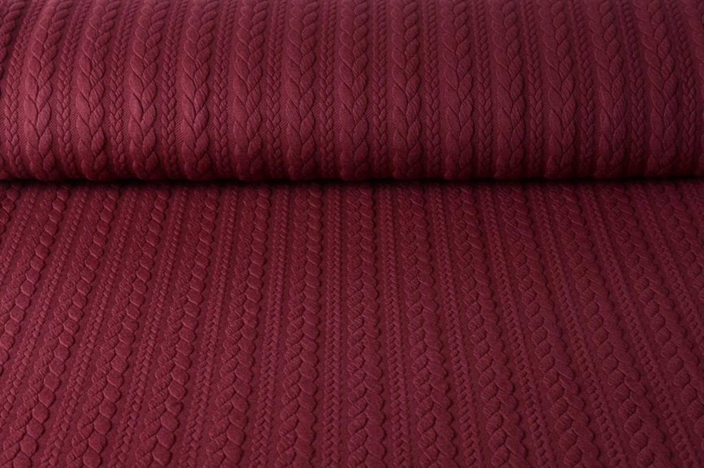 Image of knit fabric with a knit pattern - burgundy cables 340 g/m² – available at Šarlotes audumi