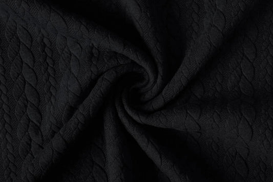 Tissu en maille à motif tricoté - tresses noires 340 g/m² – disponible chez Šarlotes audumi