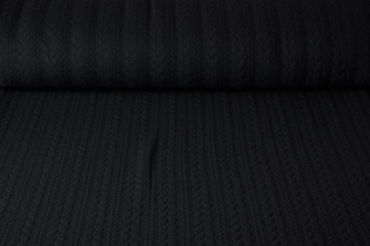 Image de tissu en maille à motif de tricot - tresses noires 340 g/m² – disponible chez Šarlotes audumi