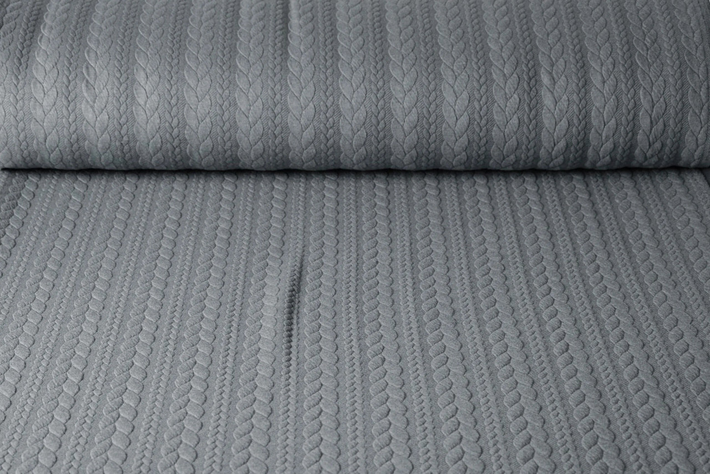 Image of knitted fabric with knit pattern - gray braids 340 g/m² – available at Šarlotes audumi