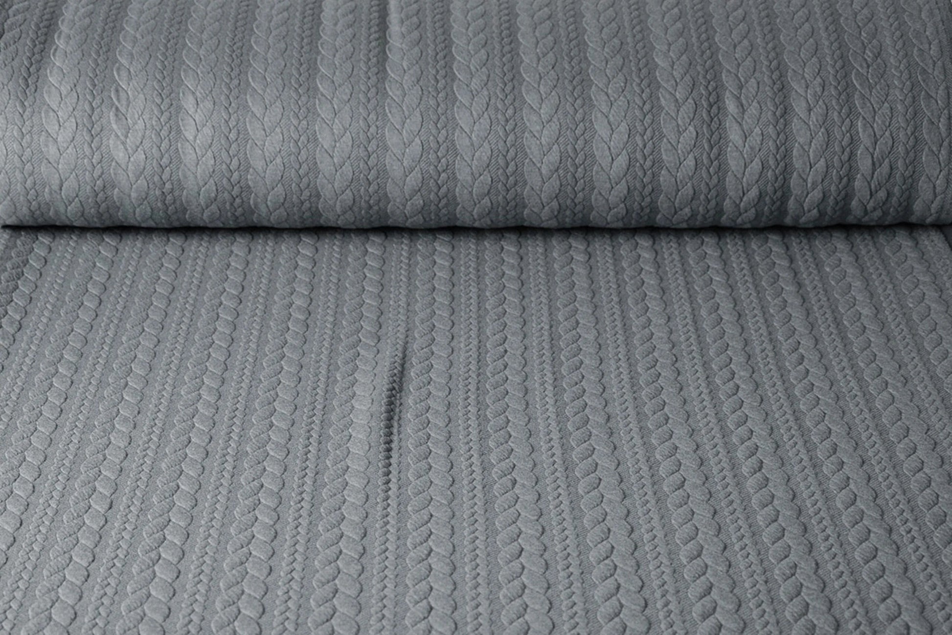 Image of knitted fabric with knit pattern - gray braids 340 g/m² – available at Šarlotes audumi