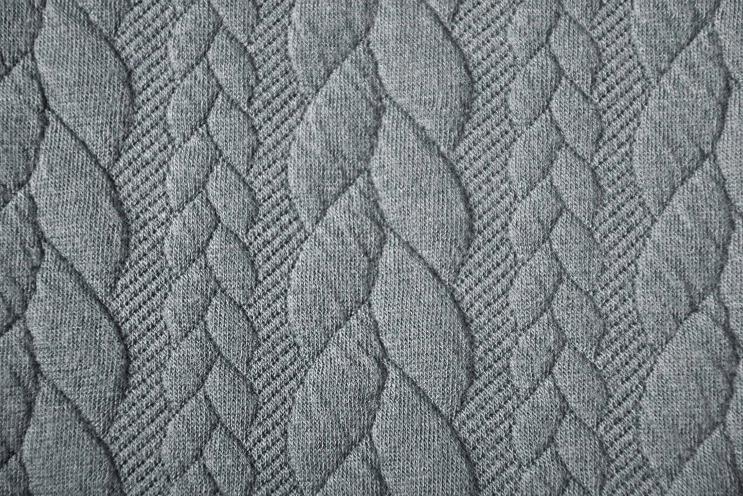 Image with knitted fabric with a knit pattern - gray braids 340 g/m² – available at Šarlotes audumi