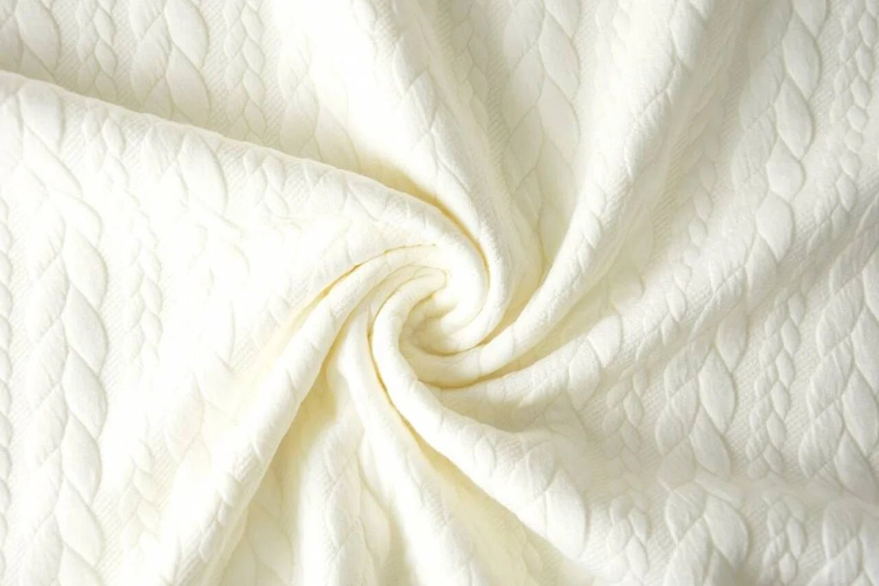 Image of knitted fabric with knit pattern, warm white – available online at Šarlotes audumi