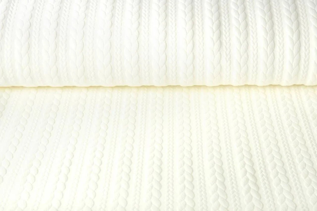 Image of jersey fabric with knitted pattern, warm white – available online at Šarlotes audumi