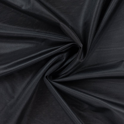 Image de tissu de doublure en jersey noir – disponible en ligne chez Šarlotes audumi
