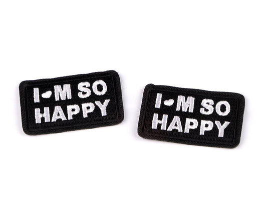 Appliqué thermocollant « I’M SO HAPPY » – 3 × 5 cm – disponible en ligne chez Šarlotes audumi