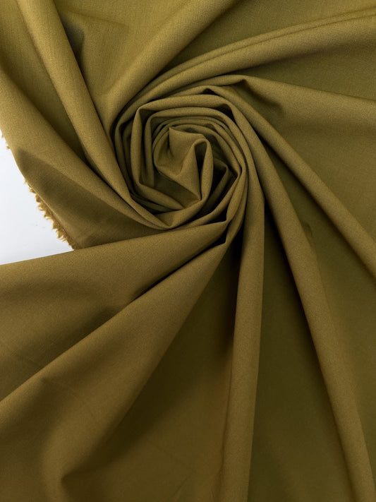 Image of wool fabric with elastane in green-brown – France – available online at Charlote’s Fabrics