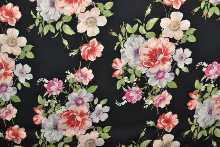 Tissu 100 % viscose - fleurs sur fond noir 100 g/m²