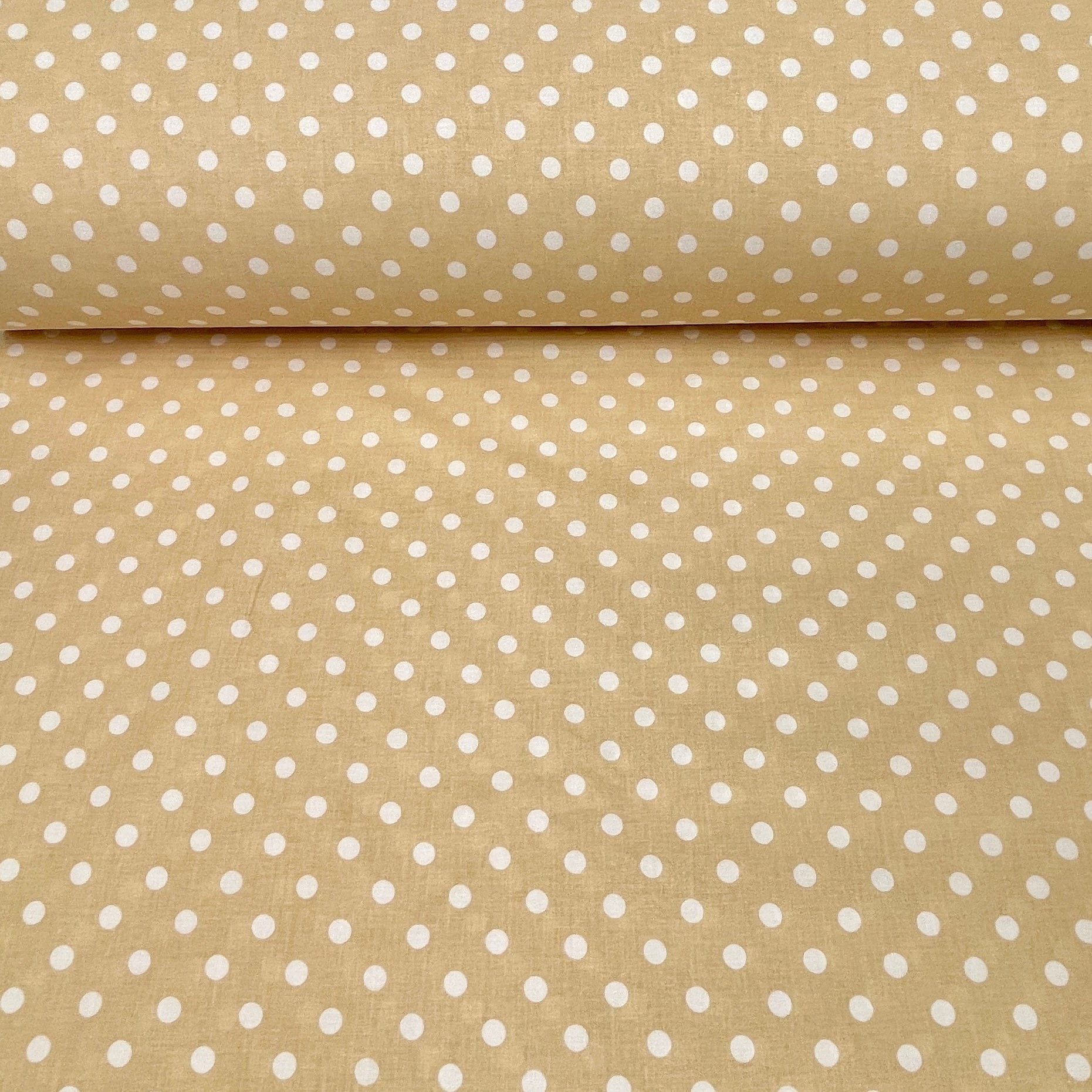 100% cotton fabric with polka dots on a soft yellow background 125 g/m²