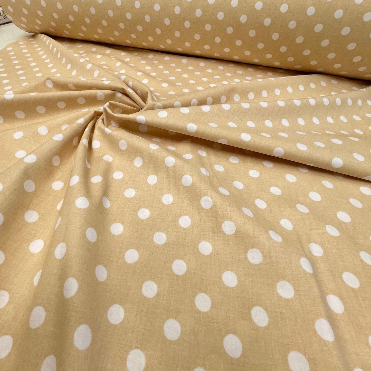 100% Cotton fabric - pom-poms on a soft yellow background 125 g/m²