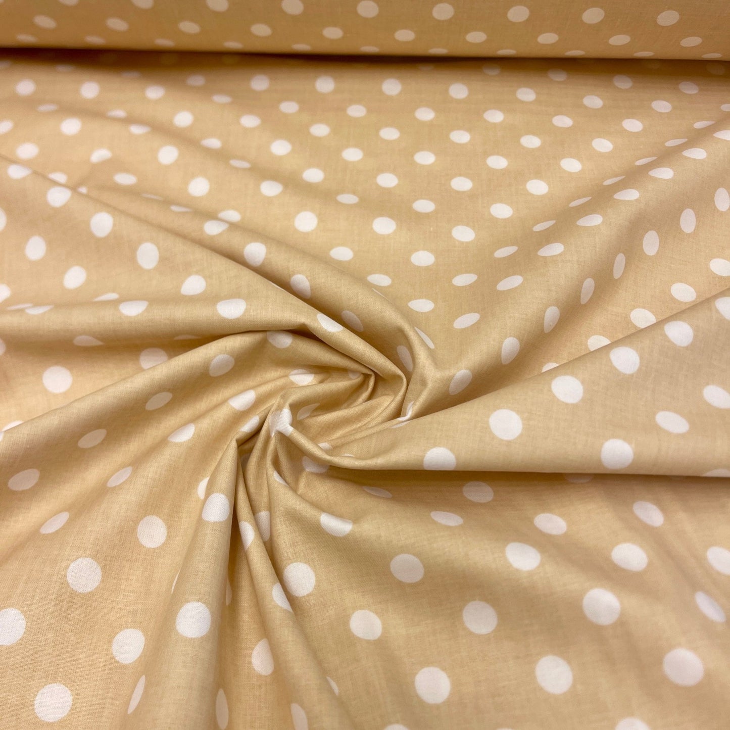 100% Cotton fabric with dots on a soft yellow background 125 g/m²