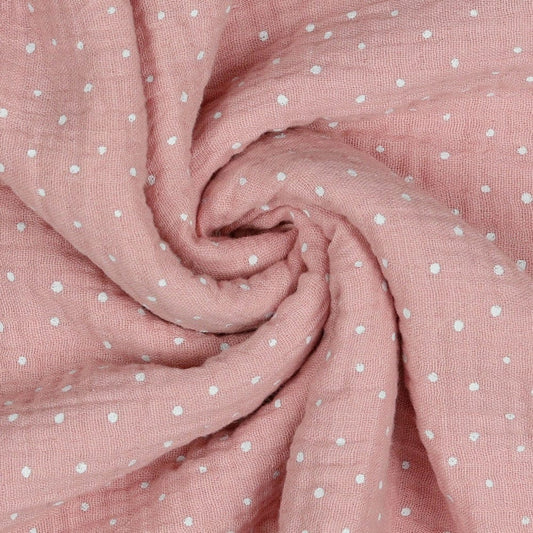 Musselin mit Pünktchen auf rosa Hintergrund 125 g/m²