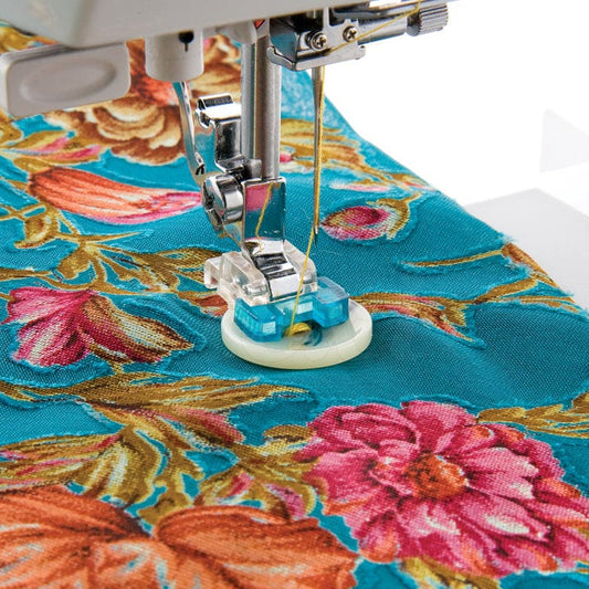 Sewing machine foot for sewing on buttons